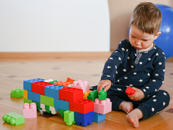 The Child Independently Plays in the Designer Close-up.